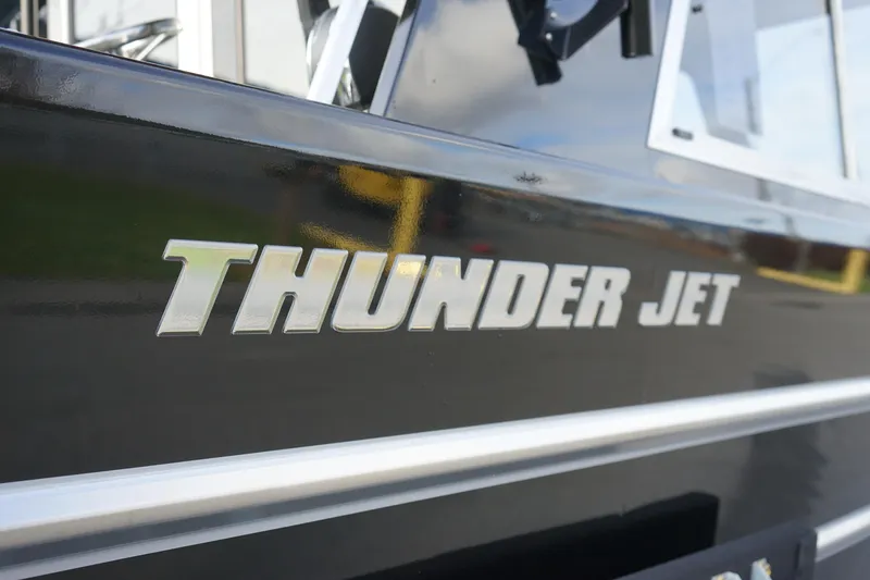 Slide: The Image of 2024 Thunder Jet 24 Alexis Pro HT boat side view. - 4