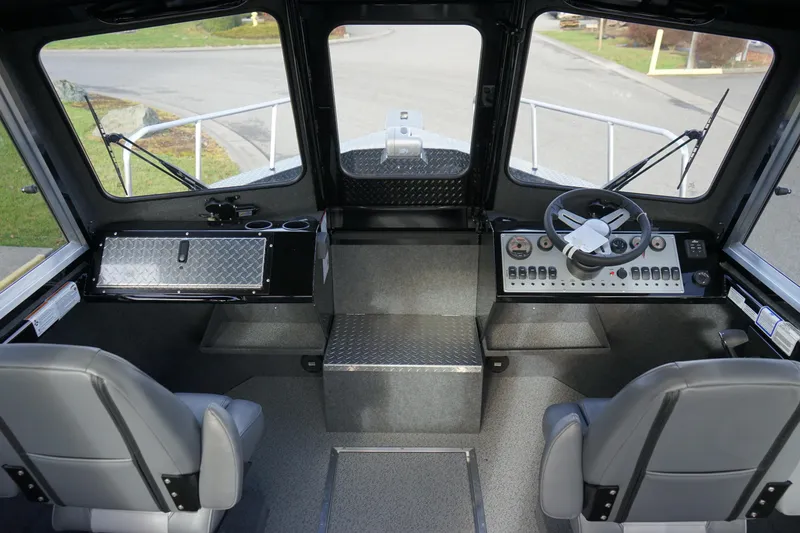 Slide: The Image of Interior cockpit of 2024 Thunder Jet 24 Alexis Pro HT boat with steering wheel and controls. - 9