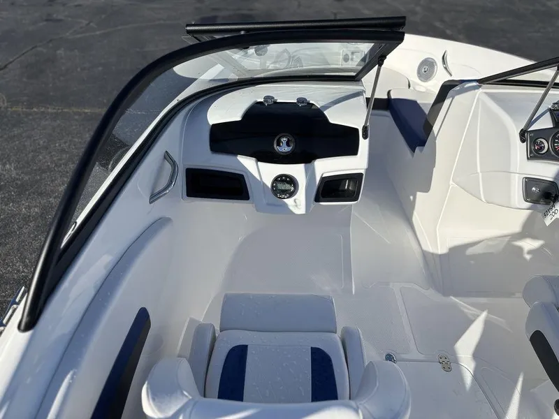 Slide: The Image of 2024 Tahoe 200 S boat interior with sleek white and black design, featuring modern controls. - 15