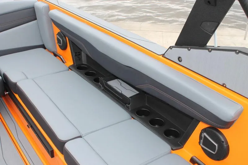 Slide: The Image of 2024 Axis T235 boat interior with gray seating and cup holders. - 12