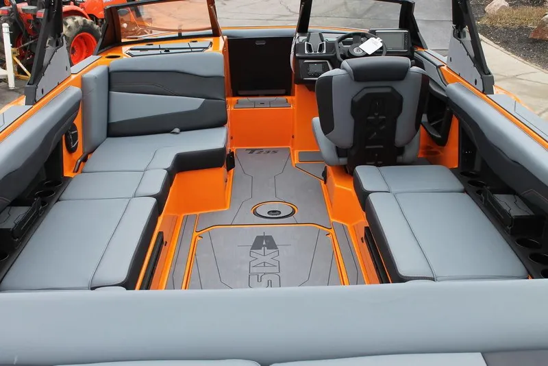 Slide: The Image of 2024 Axis T235 boat interior with orange and gray seating, modern design. - 4