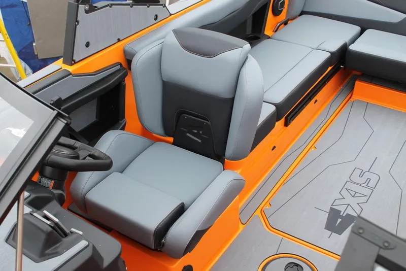 Slide: The Image of 2024 Axis T235 boat interior with gray and orange seating and flooring. - 7