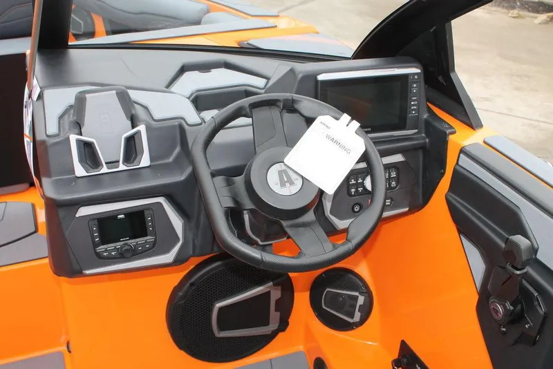 Slide: The Image of 2024 Axis T235 boat dashboard with steering wheel and control panel. - 9