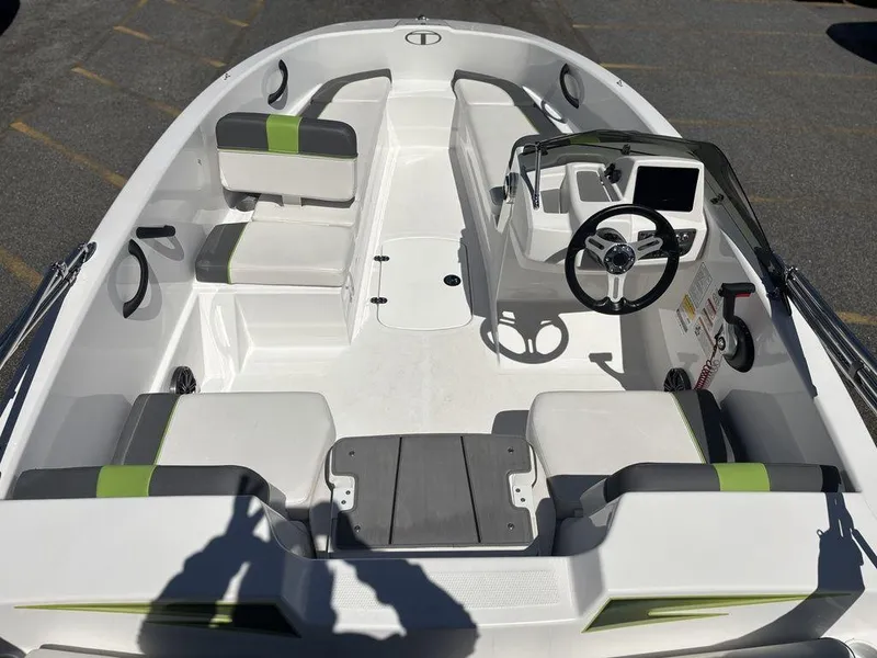 Slide: The Image of 2024 Tahoe T16 boat interior with seating, steering wheel, and modern dashboard. - 10