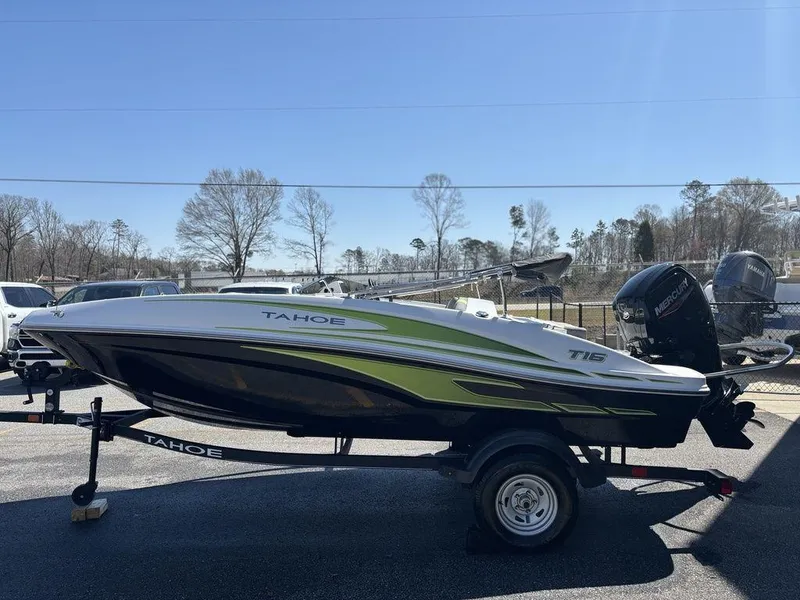 Slide: The Image of 2024 Tahoe T16 boat on trailer, side view, outdoors, sunny day. - 5