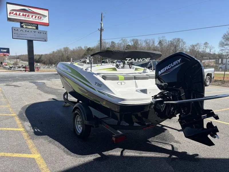 Slide: The Image of 2024 Tahoe T16 boat with Mercury engine on trailer in parking lot. - 6