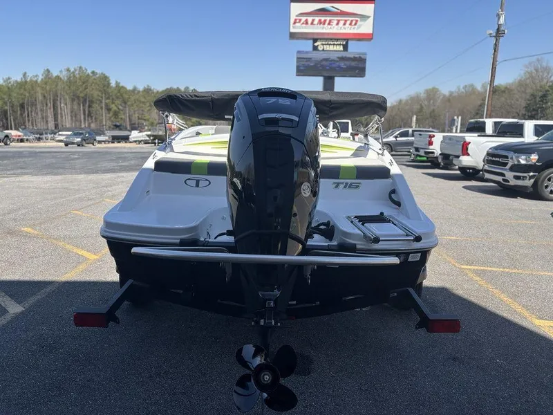 Slide: The Image of 2024 Tahoe T16 boat with outboard motor in a parking lot. - 7