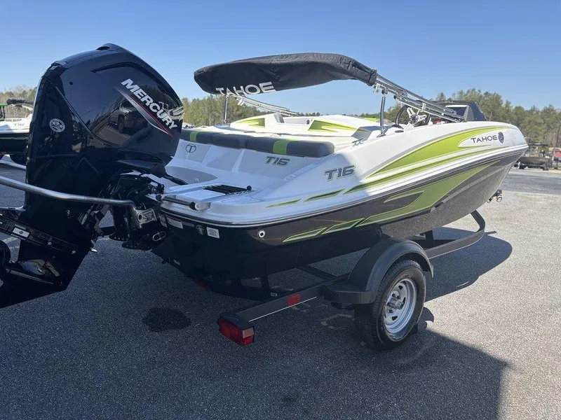 Slide: The Image of 2024 Tahoe T16 boat with Mercury engine on trailer, outdoor setting. - 8
