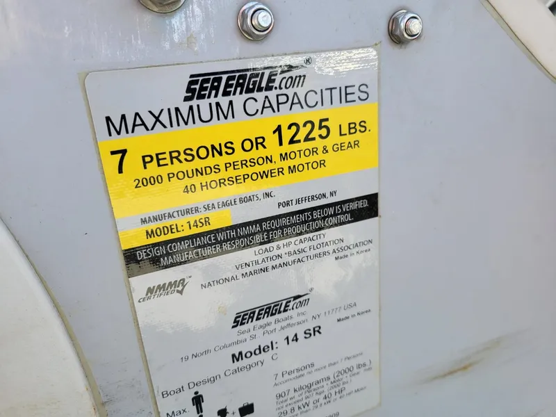 Slide: The Image of Label on Sea Eagle 14SR inflatable boat showing maximum capacity and specifications. - 11