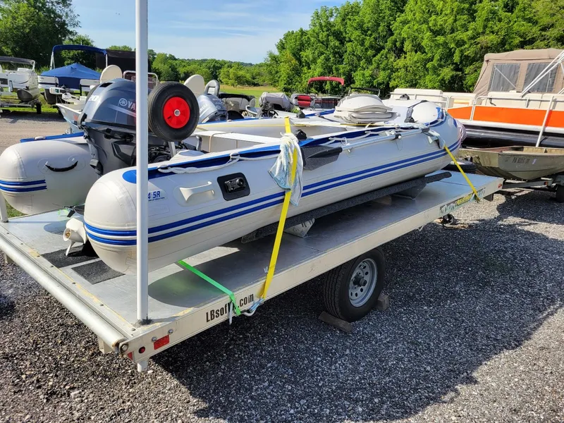 Slide: The Image of Sea Eagle 14SR inflatable boat on aluminum trailer with 2021 Yamaha 20 hp motor. - 4