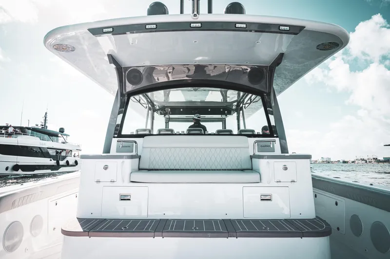 Slide: The Image of 2023 HCB 65 Estrella luxury boat interior with seating and Garmin equipment. - 1
