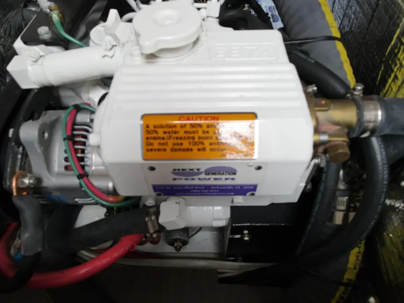 Slide: The Image of Close-up of the engine in a 2016 Beneteau Oceanis 35.1 sailboat. - 16