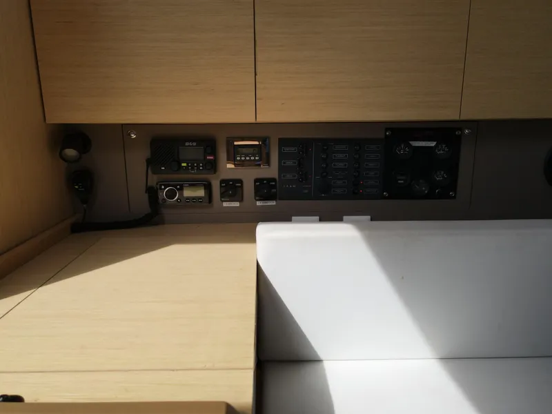 Slide: The Image of Control panel and navigation equipment inside a 2016 Beneteau Oceanis 35.1 sailboat. - 18