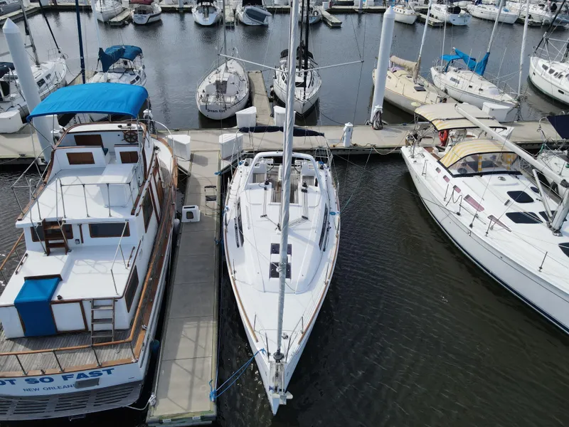 Slide: The Image of Beneteau Oceanis 35.1 2016 sailboat docked at marina, aerial view. - 2