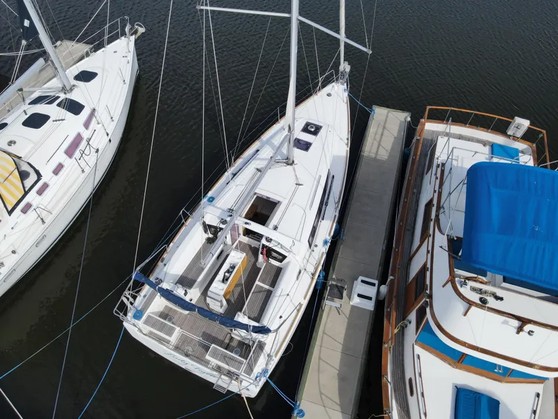 Slide: The Image of Aerial view of a 2016 Beneteau Oceanis 35.1 sailboat docked at a marina. - 4