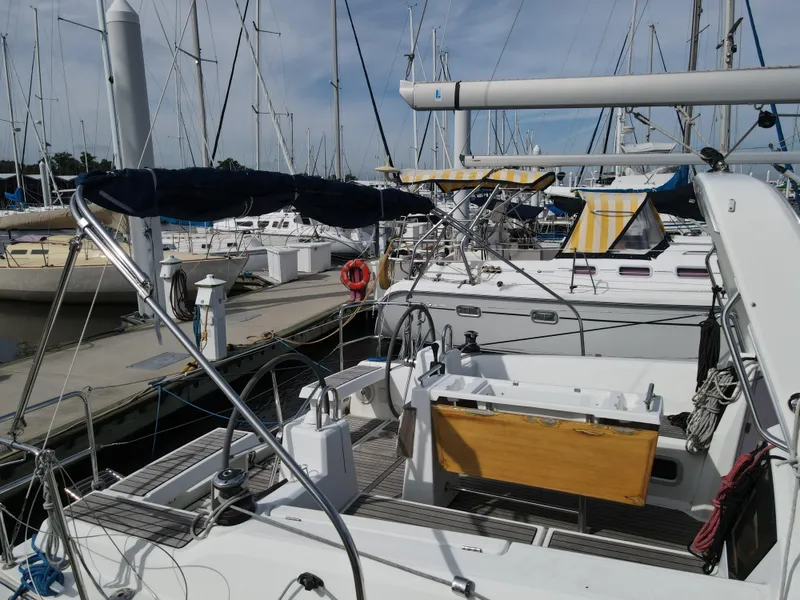 Slide: The Image of Beneteau Oceanis 35.1 2016 sailboat docked at marina with other boats. - 7