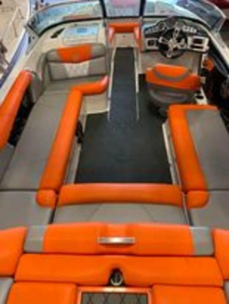 Slide: The Image of 2014 MasterCraft X30 boat interior with orange and gray seating. - 4
