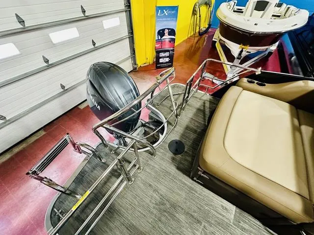 Slide: The Image of 2024 Godfrey Pontoons Monaco 235 SFL GTP 27 In. Center Tube Package, rear view with motor and seating. - 14