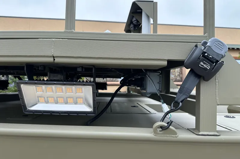 Slide: The Image of 2024 Tracker Grizzly 2072 CC Sportsman boat detail with mounted LED light and strap. - 12
