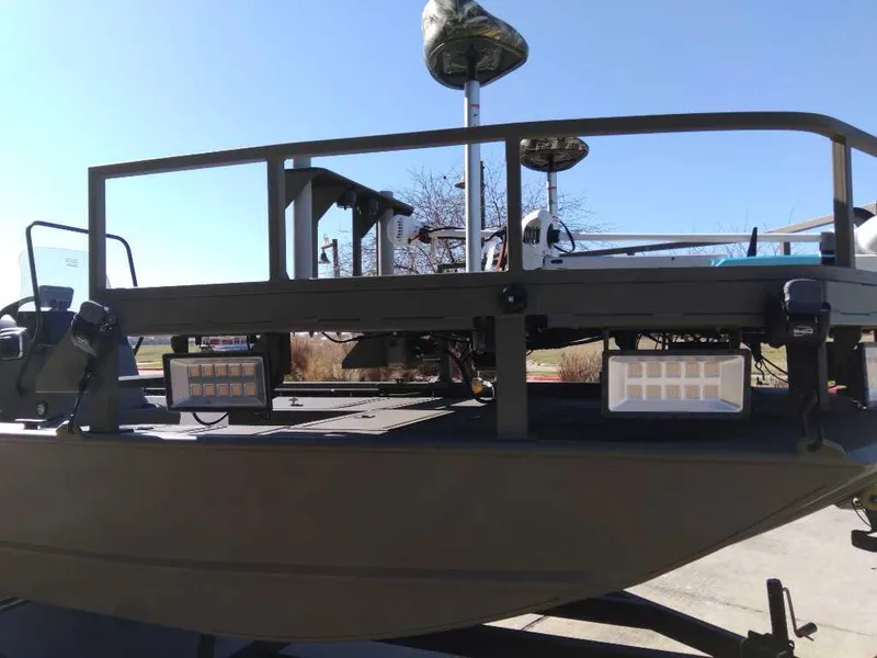 Slide: The Image of 2024 Tracker Grizzly 2072 CC Sportsman boat with elevated deck and mounted lights. - 4