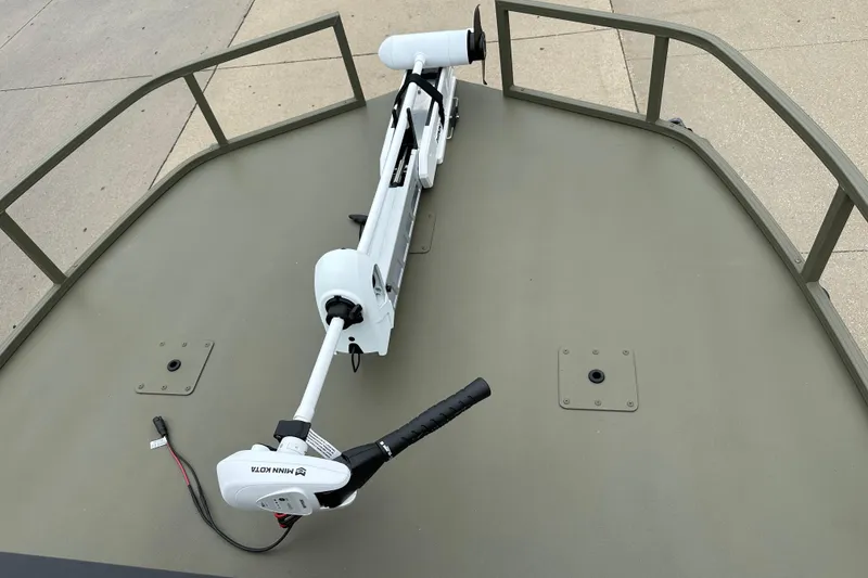 Slide: The Image of 2024 Tracker Grizzly 2072 CC Sportsman boat with Minn Kota trolling motor on deck. - 10