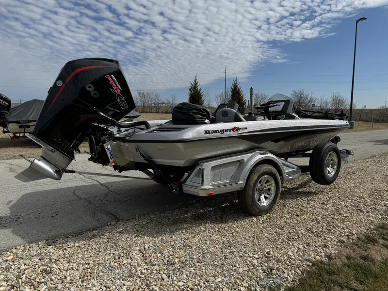 Slide: The Image of 2024 Ranger Z518 Ranger Cup Equipped boat on a trailer, parked outdoors. - 9