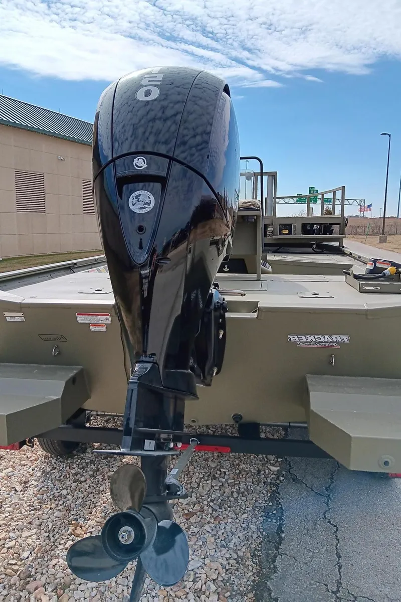 Slide: The Image of 2024 Tracker Grizzly 2072 CC Sportsman boat with outboard motor. - 2