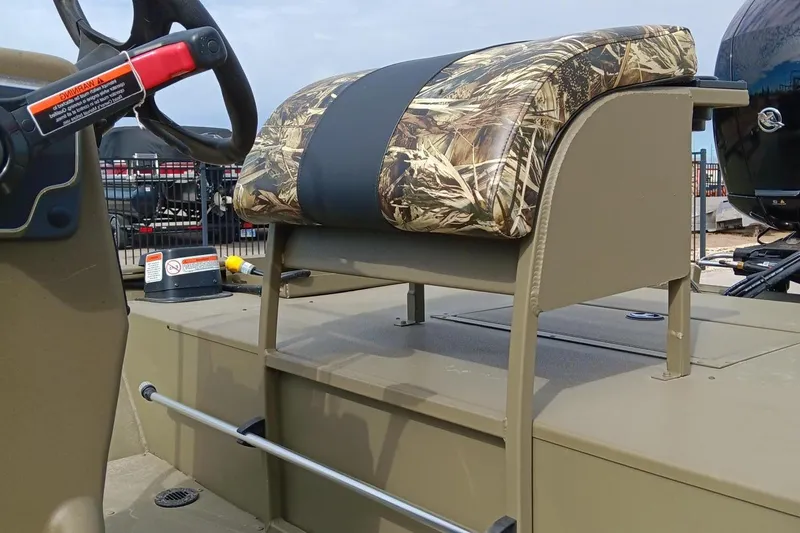 Slide: The Image of 2024 Tracker Grizzly 2072 CC Sportsman boat seat and steering wheel. - 6