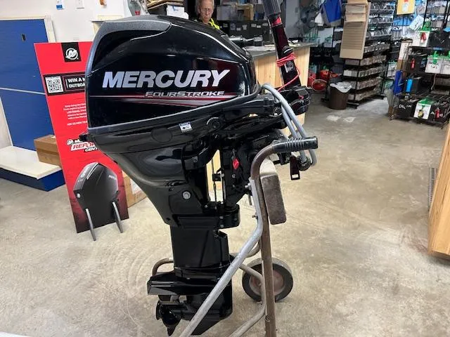 Slide: The Image of 2015 Mercury 15ML FourStroke outboard motor displayed in a store. - 3