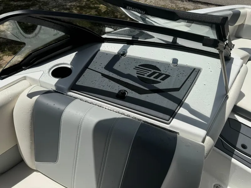 Slide: The Image of 2024 Malibu LX-R boat interior with wet dashboard and cup holder. - 15