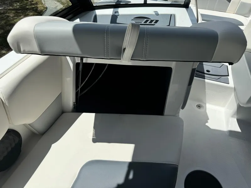 Slide: The Image of 2024 Malibu LX-R boat interior with adjustable seating and storage compartment. - 17
