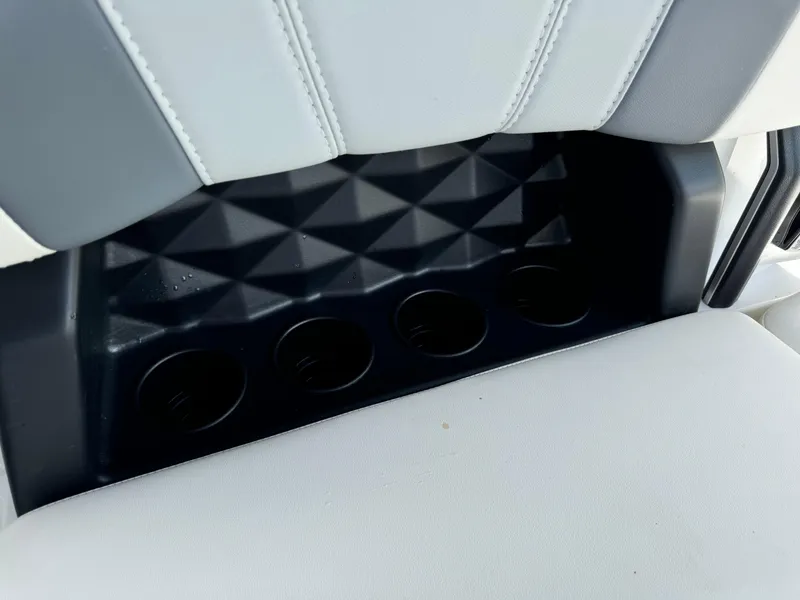 Slide: The Image of 2024 Malibu LX-R rear seat cup holders and storage compartment. - 23