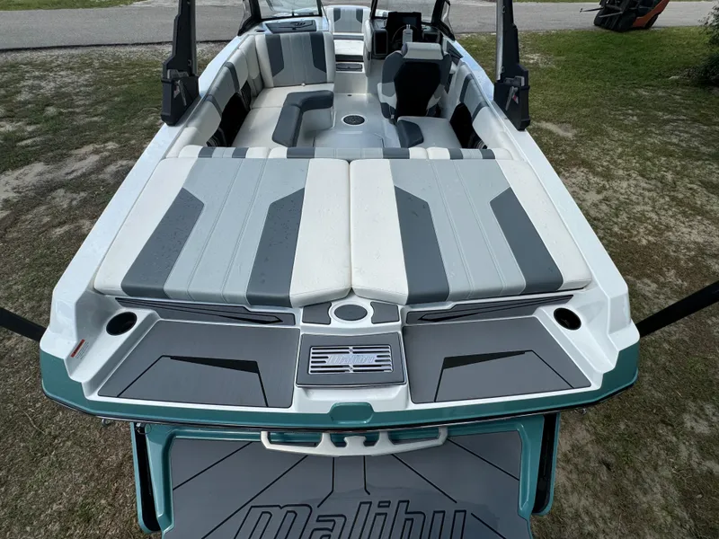 Slide: The Image of 2024 Malibu LX-R boat interior with gray and white seating. - 24
