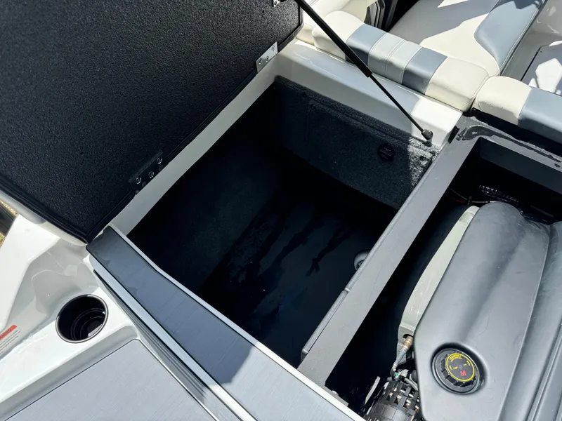 Slide: The Image of 2024 Malibu LX-R boat storage compartment and engine bay. - 31