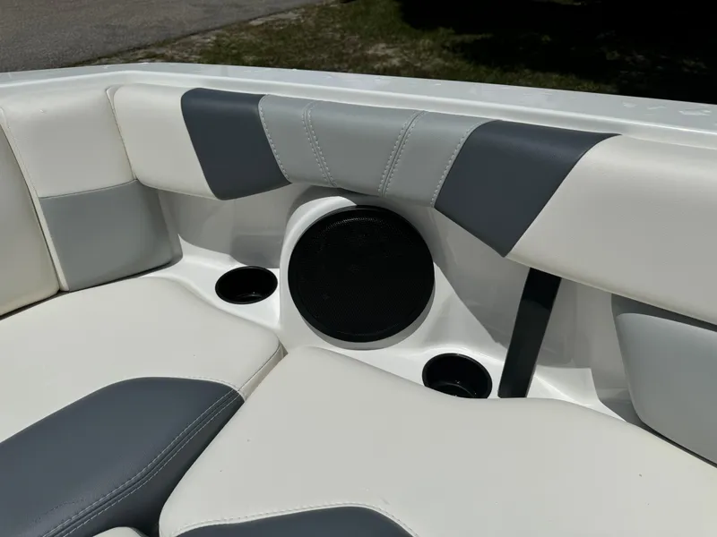 Slide: The Image of 2024 Malibu LX-R boat interior with cushioned seating and built-in speaker. - 8