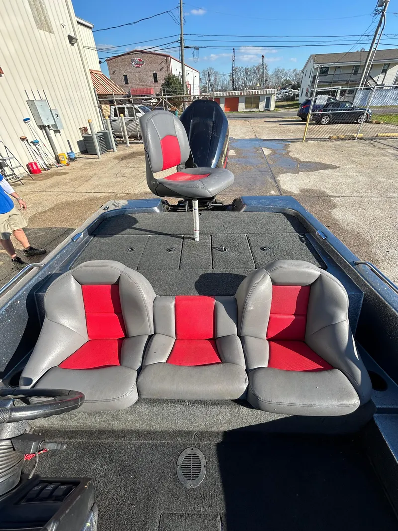 Slide: The Image of 2003 Skeeter SX 200 boat dashboard with steering wheel and navigation system. - 24