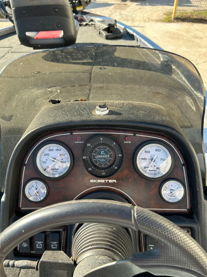 Slide: The Image of 2003 Skeeter SX 200 boat deck with fishing seat and equipment. - 26