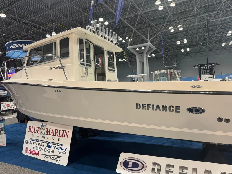 Slide: The Image of 2024 Defiance 260 Admiral EX boat displayed at a marine exhibition. - 1