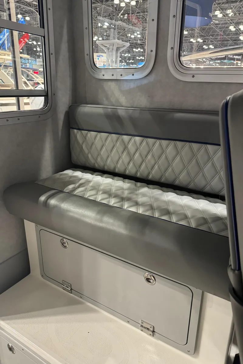 Slide: The Image of 2024 Defiance 260 Admiral EX captain's chair with diamond-stitched upholstery. - 22