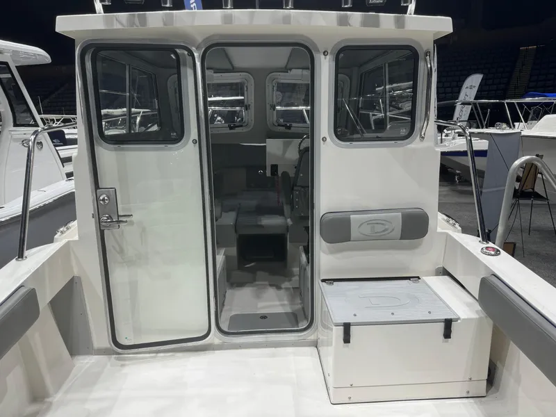Slide: The Image of 2024 Defiance 260 Admiral EX boat interior with seating and storage compartments. - 27