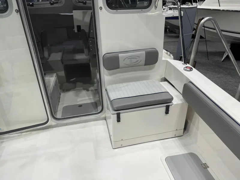 Slide: The Image of 2024 Defiance 260 Admiral EX boat interior with glass doors and seating. - 28