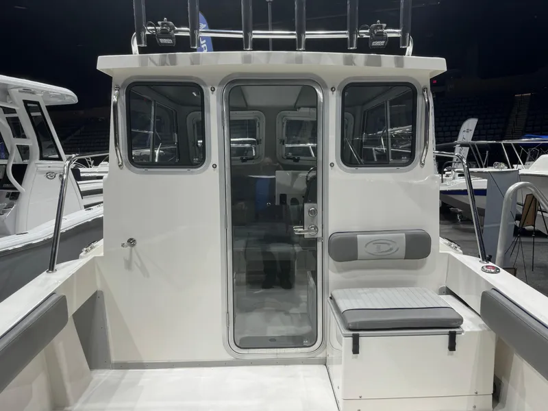 Slide: The Image of 2024 Defiance 260 Admiral EX boat interior seating area. - 29