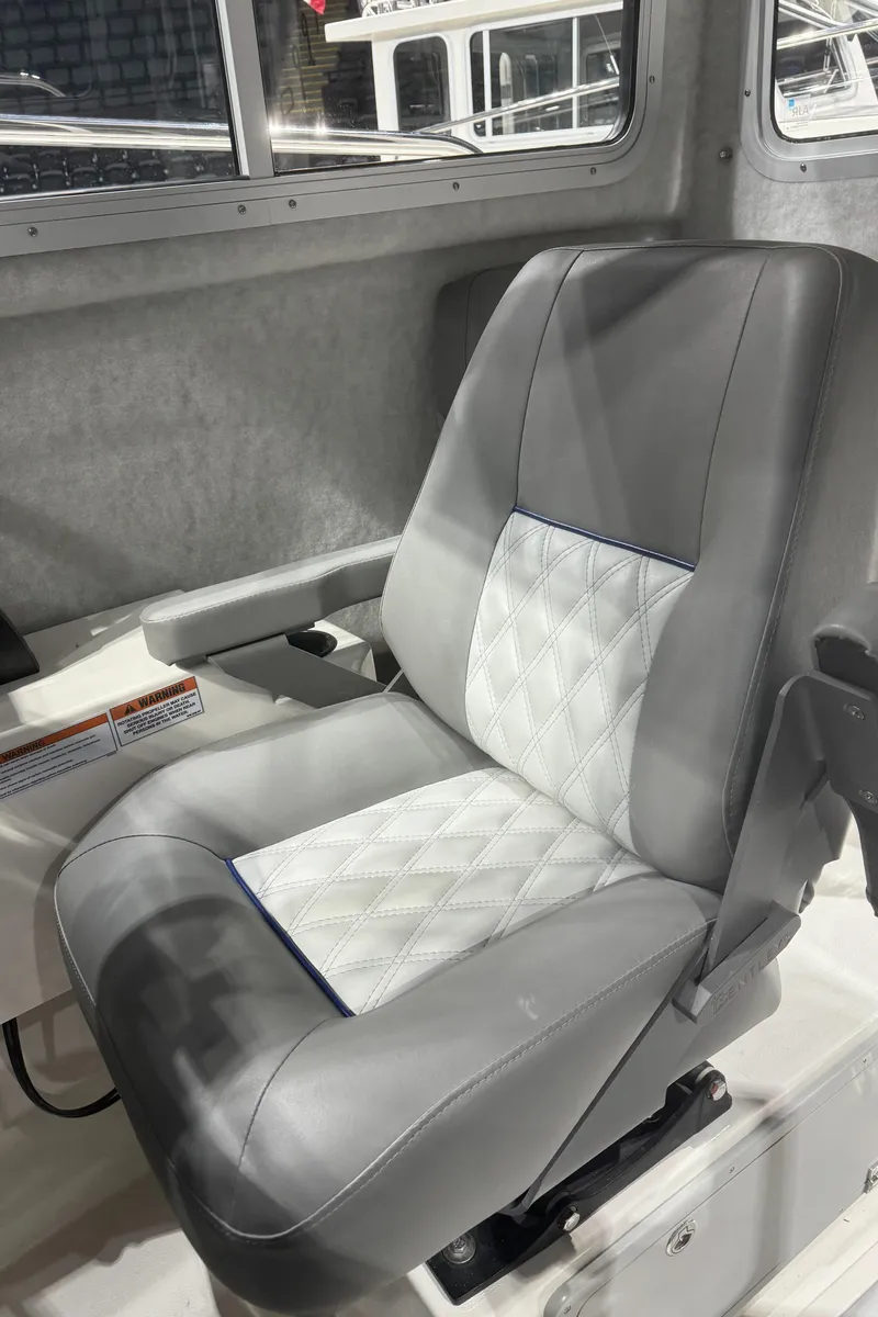 Slide: The Image of 2024 Defiance 260 Admiral EX boat interior seat with diamond-stitched upholstery. - 36