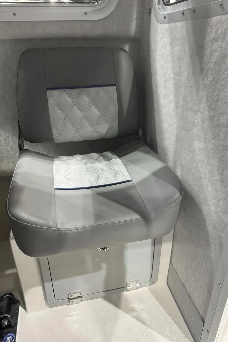 Slide: The Image of 2024 Defiance 260 Admiral EX boat interior seat with gray and white upholstery. - 39