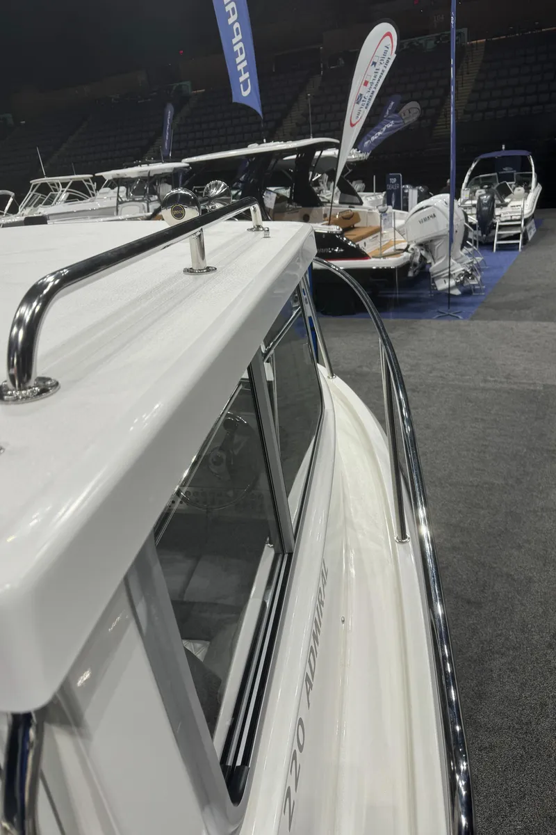 Slide: The Image of 2024 Defiance 260 Admiral EX boat interior with seating and storage compartments. - 6