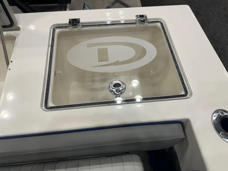 Slide: The Image of 2024 Defiance 260 Admiral EX boat interior with glass door and seating. - 11