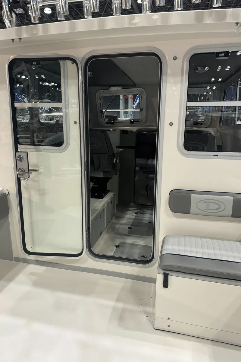 Slide: The Image of 2024 Defiance 260 Admiral EX boat storage compartment with drainage. - 13