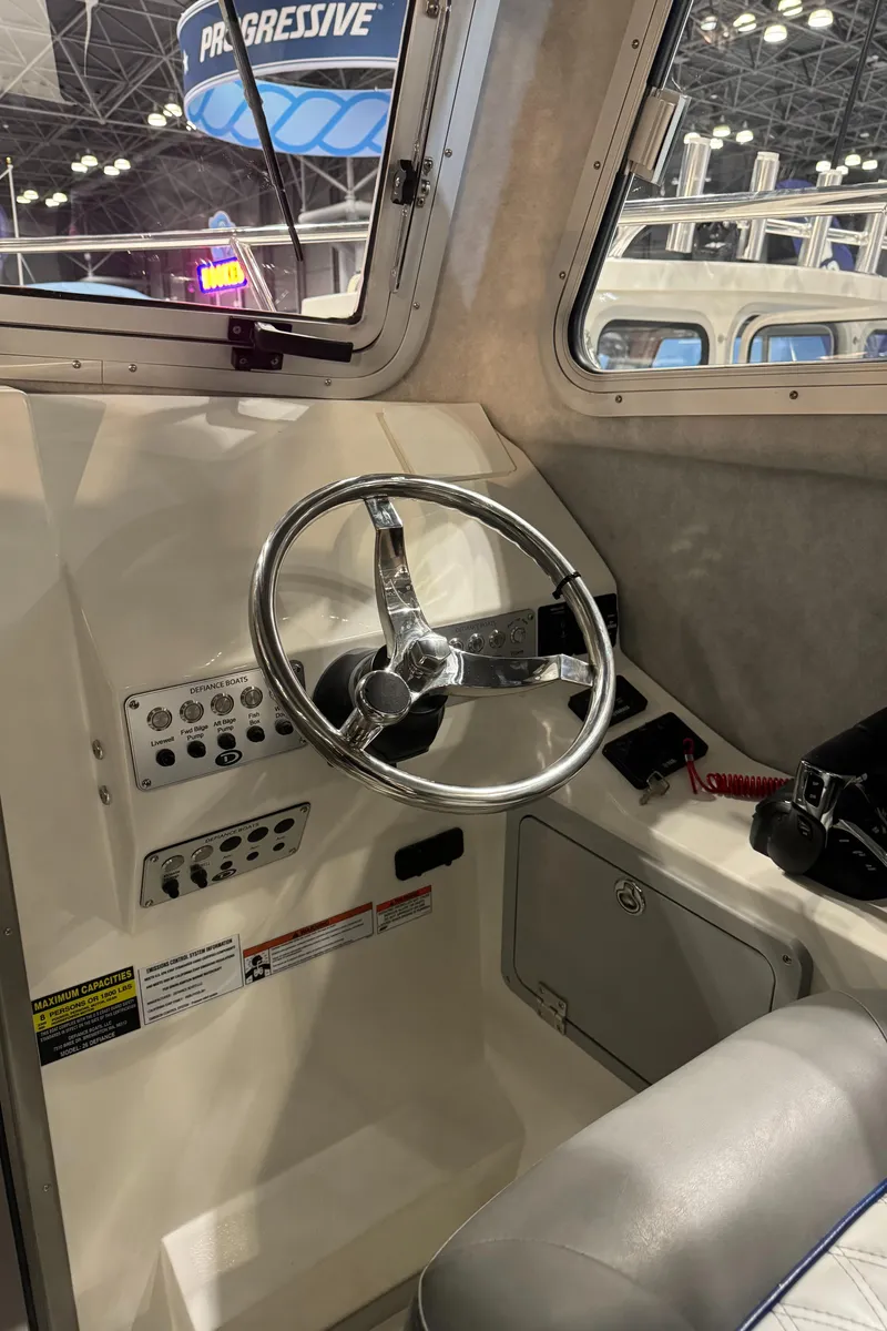 Slide: The Image of 2024 Defiance 260 Admiral EX dashboard with Garmin and Yamaha displays. - 20