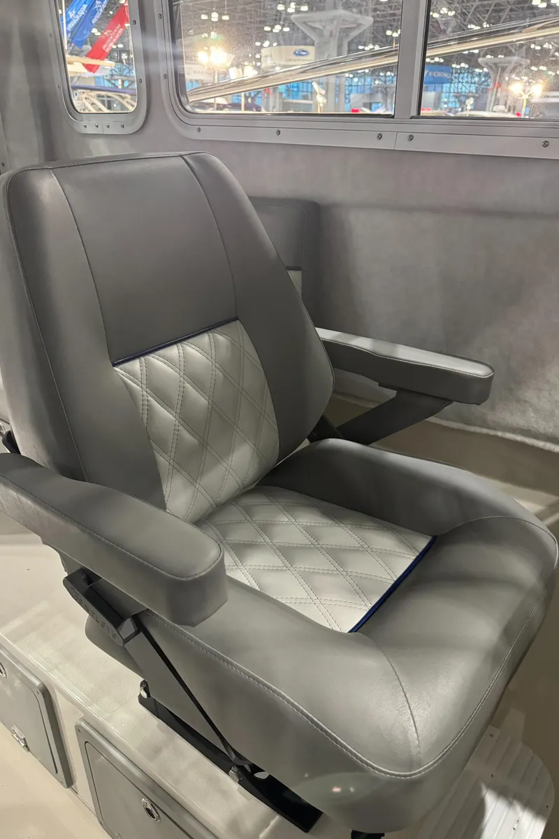 Slide: The Image of 2024 Defiance 260 Admiral EX helm with Garmin navigation system and steering wheel. - 21