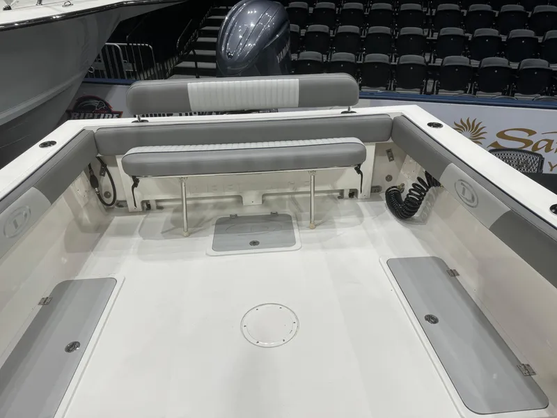 Slide: The Image of 2024 Defiance 260 Admiral EX boat deck with dual outboard motors. - 26